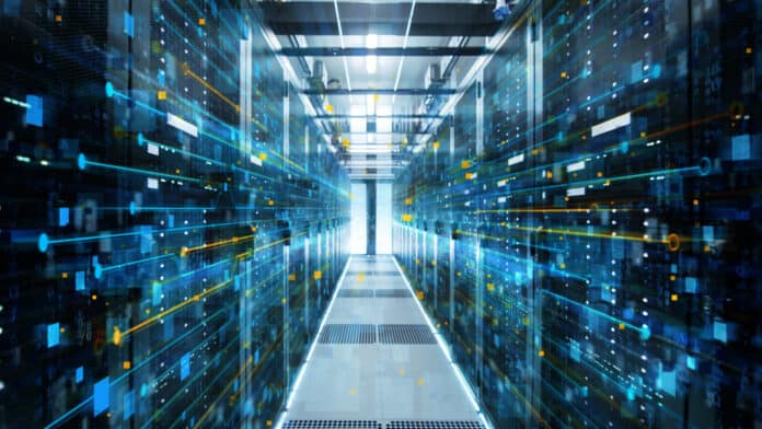 Adobe Stock royalty-free image #200146313, 'Shot of Corridor in Working Data Center Full of Rack Servers and Supercomputers with Internet connection Visualisation Projection.' uploaded by Gorodenkoff, standard license purchased from https://stock.adobe.com/images/download/200146313; file retrieved on May 9th, 2019. License details available at https://stock.adobe.com/license-terms - image is licensed under the Adobe Stock Standard License
